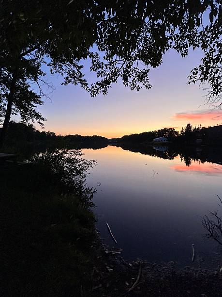 istock Lake Sunset Reflection with Vibrant Twilight Sky and Tree Silhouettes – Peaceful Nature Landscape 2247996076