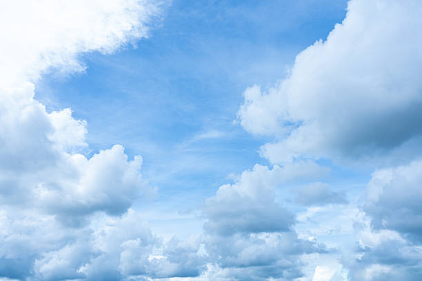 istock Bright blue sky with dramatic white and grey cumulus clouds framing the upper atmosphere 2247999020
