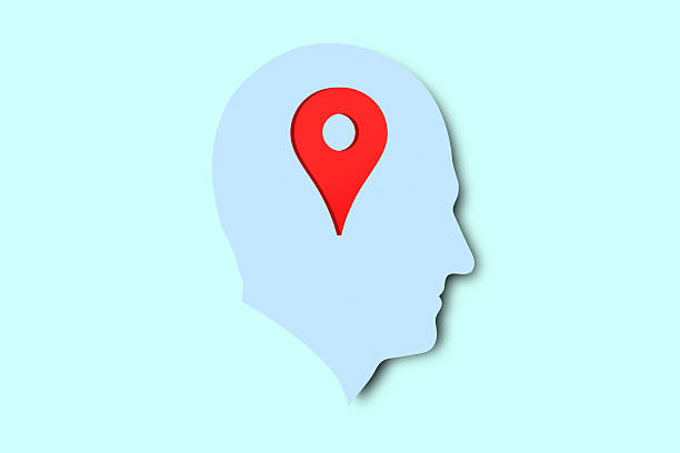A geo location pin inside a silhouette of a man's head