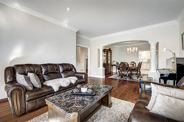 Extensive photographic coverage of a contemporary two-storey stone-clad residence, including exterior views, architectural details, landscaped yard, paved driveway, and the full interior layout. The interior series documents living areas, kitchen, dining room, bedrooms, bathrooms, hallways, basement, and structural details, illustrating the condition, design quality, and spatial organization of the property. The collection is suitable for editorial uses, real-estate documentation, architectural analysis, and property marketing.