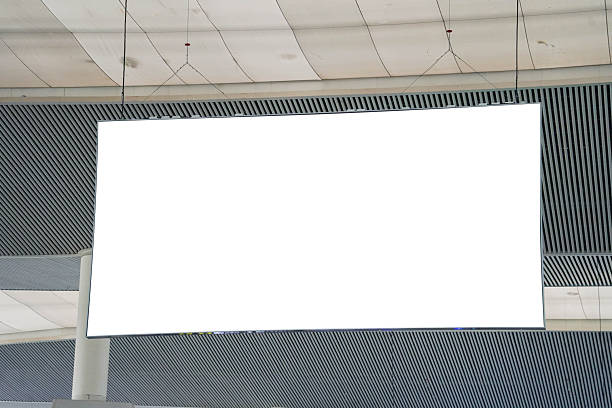 istock Blank advertising billboard hanging in the train station. Blank White Banners Hanging From Ceiling. 2248013532