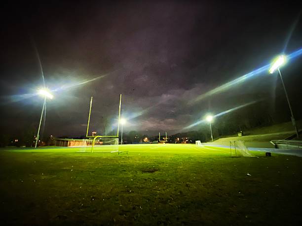 istock Empty Football Field at Night with Lights 2248014118