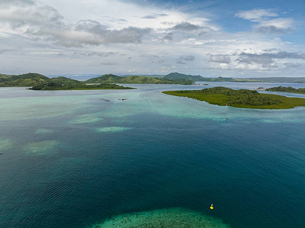 istock Green islands surrounded by shallow turquoise water. Siargao, Philippines. 2248014280