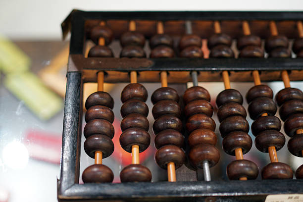istock Traditional Chinese abacus with wooden beads for counting 2248014791