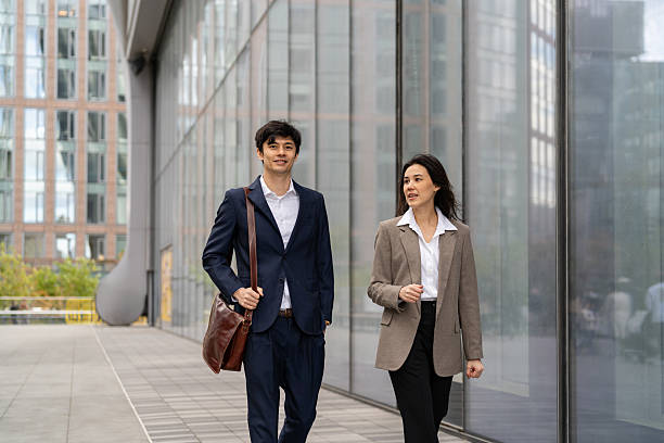 istock Two asian people going to work in the city 2248016568