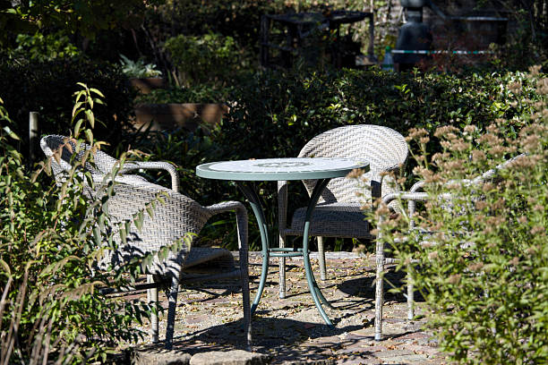 istock A garden table with chairs are placed in a garden. 2248017346