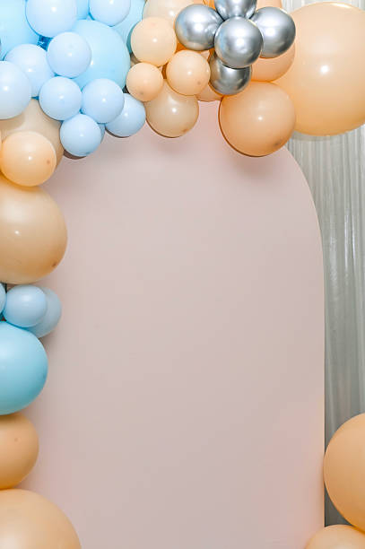 istock pastel balloon arch in soft light, forming an elegant party backdrop. 2248019882