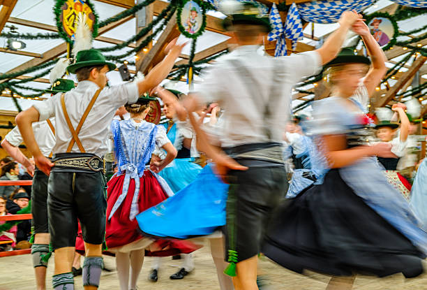 Munich, Germany - October 5: typical bavarian dancer with traditional clothes at the oktoberfest in munich on October 5, 2025