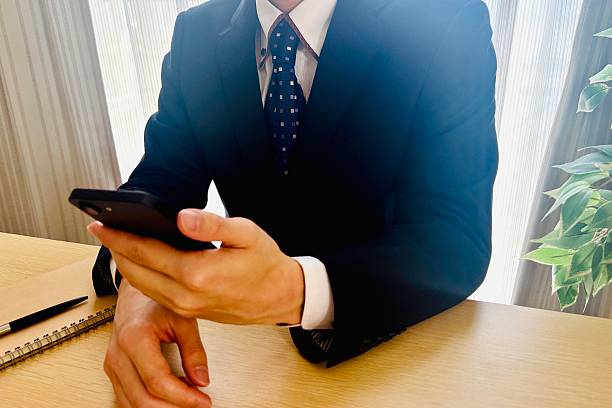 istock Businessman Checking His Smartphone at the Desk 2248025684