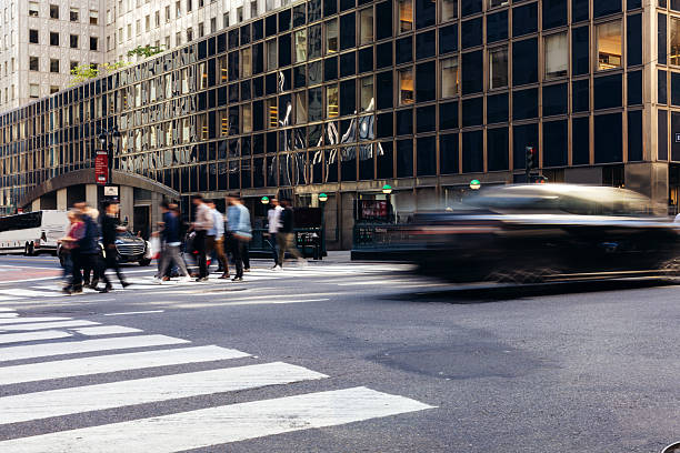 istock Fast-paced urban scene featuring active commuters at a large intersection in New York City 2248026254