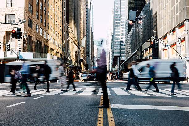 istock Fast-paced urban scene featuring active commuters at a large intersection in New York City 2248026262