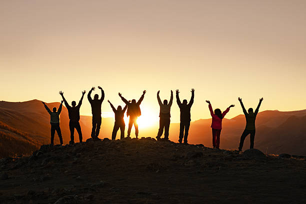 istock Large group of happy people at mountain top 2248026824