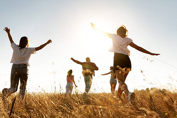 istock Group of friends runs at sunset field 2248029836
