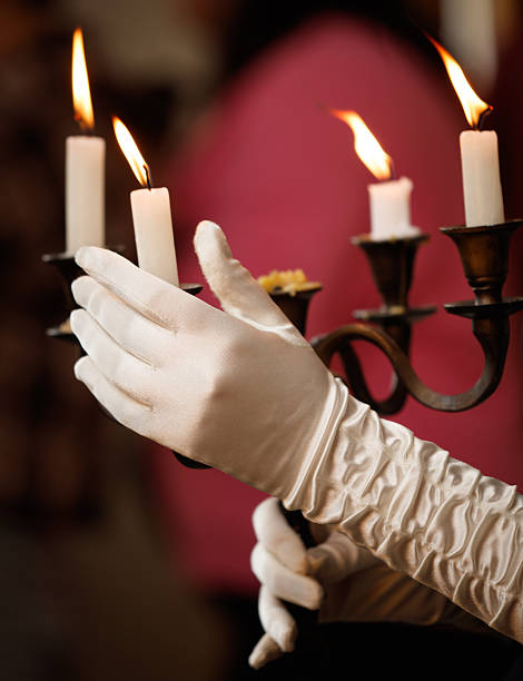 istock A person is holding a candle holder with four candles 2248033030