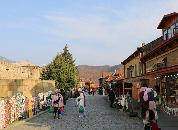 Mtskheta, Georgia-November 12,2025:Unidentified people walking, standing and buying  Souvenirs in a Beautiful Autumn DayMtskheta is a city in the region of Mtskheta-Mtianeti, Georgia. It is one of the oldest continuously inhabited cities in the world. It is located approximately 20 km north of Tbilisi, at the confluence of the Kura and Aragvi rivers.