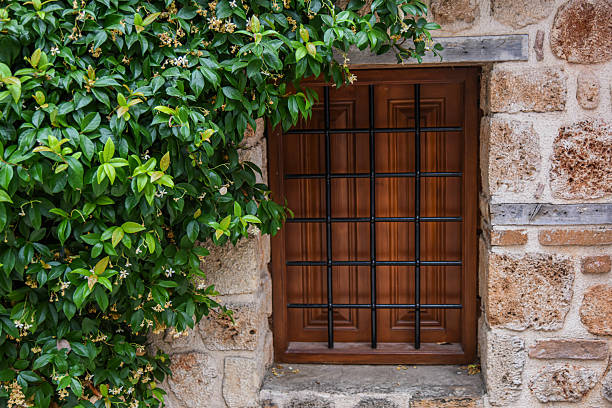 istock Symmetrical Arched Windows in a Stone Masonry Wall 2248035386