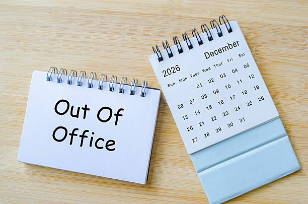 istock Out of office notification text on notepad with December calendar. Christmas Celebration. Holiday season concept. 2248035471