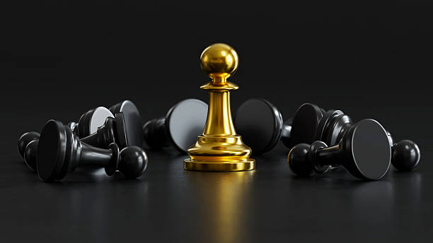 istock Golden Chess Leads fallen Black Pawns: Embodying Versatile Power & Strategic Victory 2248035600