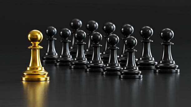 istock Golden Chess Leads Black Pawns: Embodying Versatile Power & Strategic Victory 2248035603
