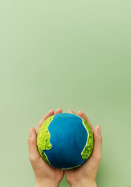 istock Earth in hands symbolizing sustainability, global environmental care 2248037353