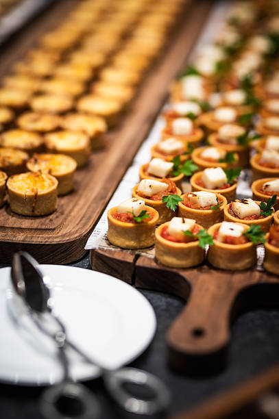 istock Different types of catering canapes on buffet 2248037412