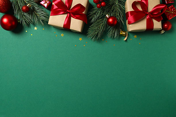 istock Christmas composition with green pine branches, ornaments on color background, festive border for seasonal greeting or holiday design 2248042980