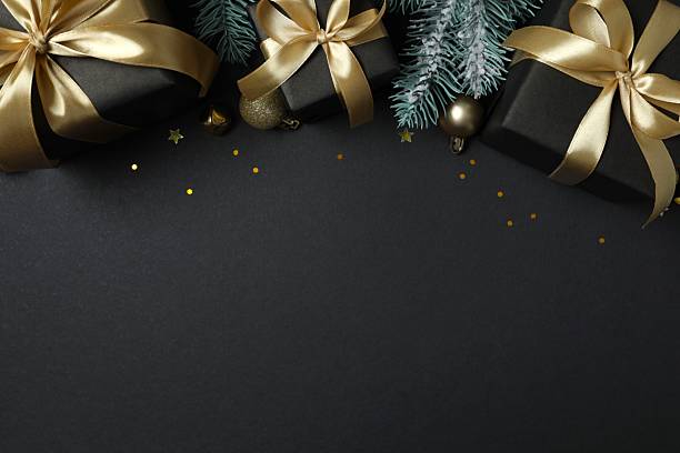 istock Beautiful festive black background contains decorations, creating a festive mood, perfect for Christmas and New Year greetings 2248043592