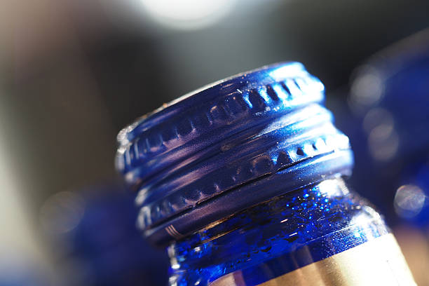 Detailed view of a cobalt blue bottle cap with a shiny finish.