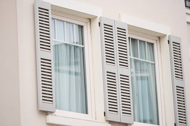 istock Elegant shutters on windows in a modern building exterior 2248044700