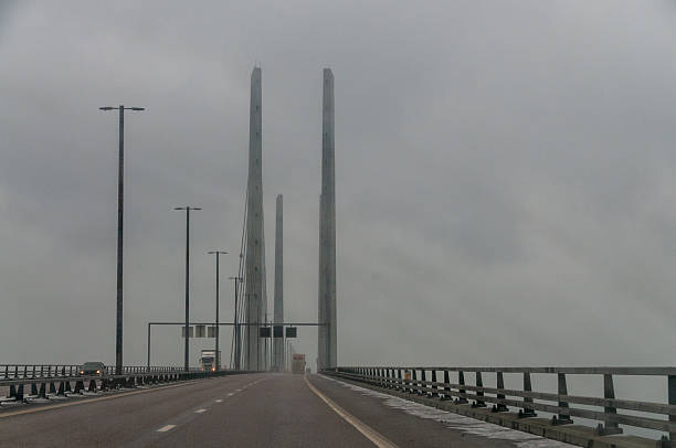 Malmo Kommun, Sweden - February 8, 2017. First person perspective of the crssing of the Oresund bridge between Denmark and Sweden, on a slighty foggy and snowy winter afternoon.