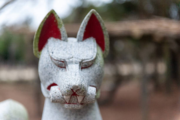 Nara, Japan - January 5, 2020. Close-up of a statue of a stone dog in the historic ciry center of Nara, Japan.