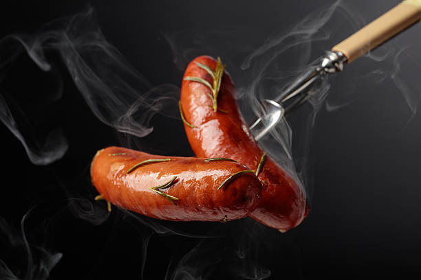 istock Roasted Bavarian sausages with rosemary. 2248047409