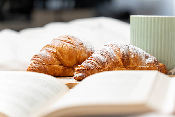 istock Relaxing Morning Reading and Pastries 2248049273