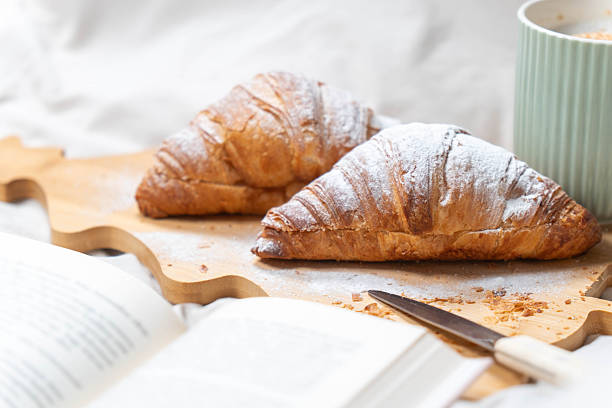 istock Christmas Morning Breakfast with Book 2248049284