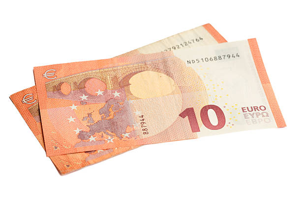 Two overlapping ten-euro banknotes displayed on a white background, showing detailed printing, warm red-orange tones, and visible security elements. The crisp isolation highlights the design features, textures, and color transitions typical of modern euro currency. The composition emphasizes clarity and financial context.