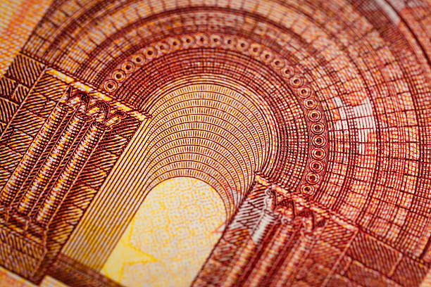 A macro closeup of an ornate arch design printed on a euro banknote, featuring dense red linework, detailed columns, and layered geometric patterns. The fine engraving highlights the precision and artistry of currency printing. Warm tones and subtle textures add depth and richness to the composition.