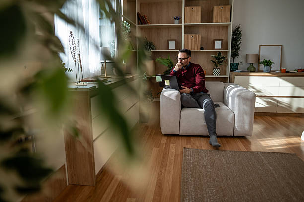 istock Adult man working from home on laptop 2248050208