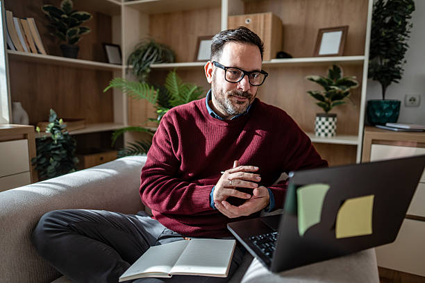 istock Man working from home having online video call 2248050298