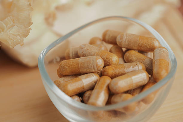 istock Herbal supplements in a bowl on wood 2248052592