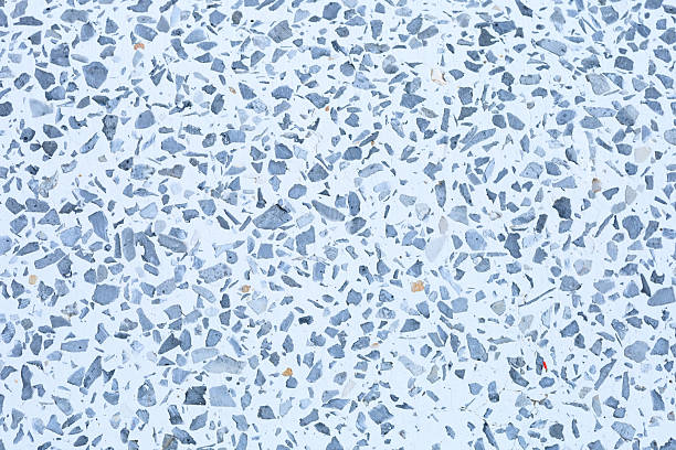 istock Monochrome Terrazzo texture background in gray and white. Seamless pattern of scattered stone aggregate. Ideal abstract surface for clean, contemporary design, product presentations, and architectural concepts. 2248055063