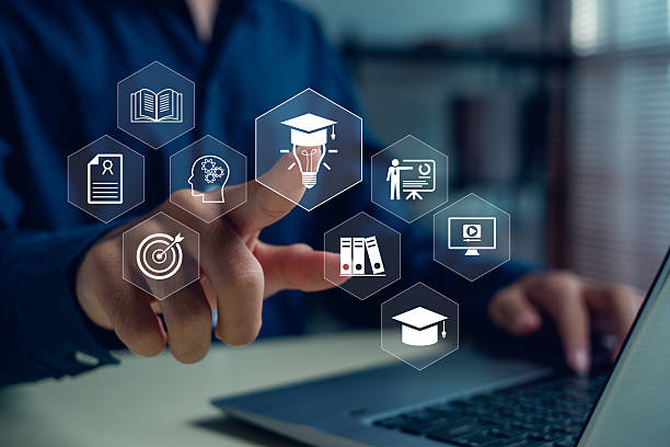 istock Businessman touching digital education icons with graduation cap, light bulb, and e-learning symbols, representing innovation learning, online study, and modern knowledge development concept. 2248063965