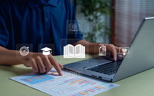 istock Man using laptop and analyzing charts with digital education icons. Concept of e-learning, online study, data-driven education, academic success, and modern digital learning technology. 2248063970