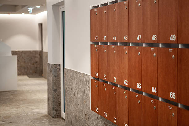istock A well-designed hallway with wooden lockers lining the wall provides secure storage for residents or visitors in a contemporary building. Soft lighting enhances the inviting space 2248066414