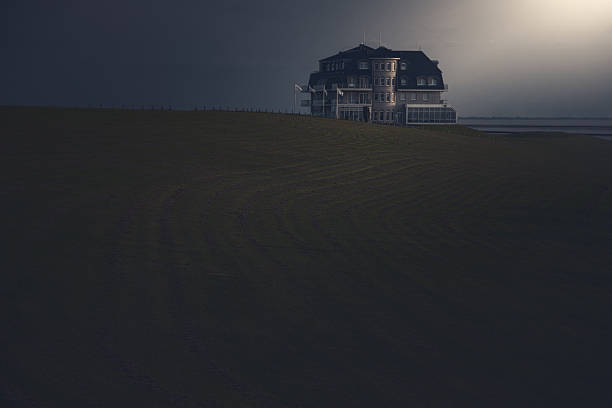 istock A lonely house in a field in a gloomy atmosphere. 2248067320