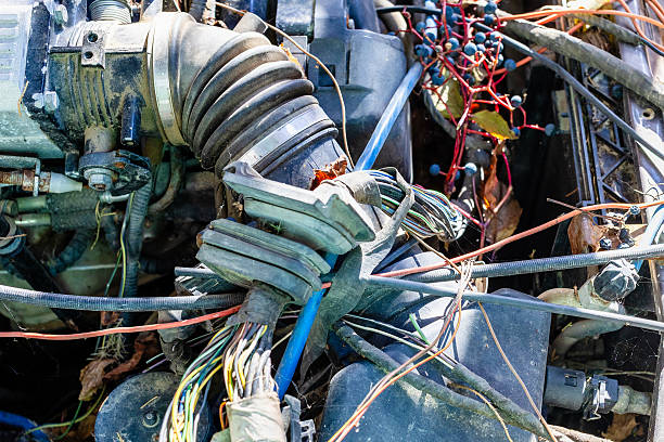 air duct in underhood space in old abandoned car outdoors on autumn day