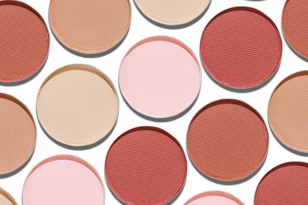 istock Swatches eyeshadow refills as minimal geometric pattern on white. Pastel matte pans brown beige nude shades with sun shadows, detailed texture, cosmetic, beauty concept makeup, top view layout 2248070266