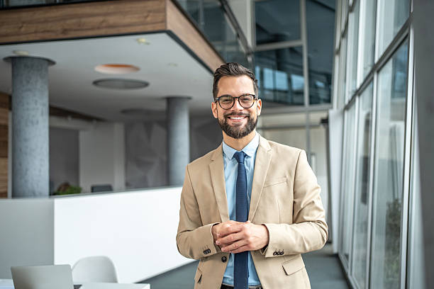 istock Confident businessman smiling in modern office environment 2248072337