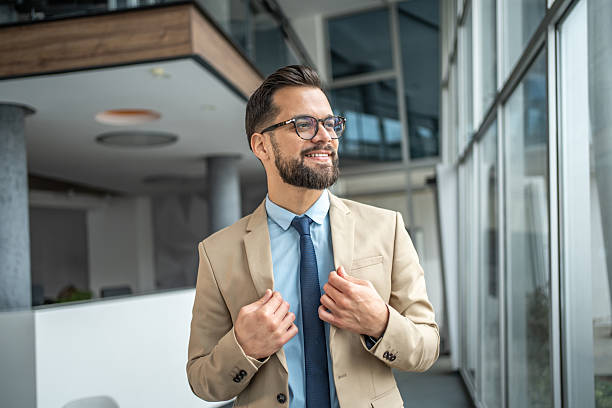 istock Young businessman smiling confidently in modern office 2248072367