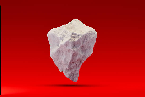 A serene winter scene featuring a snow-covered rock set against a cold red background. This minimalist and tranquil design captures the essence of winter, perfect for seasonal, nature, or holiday-themed projects. Digitally generated image. 3d render.