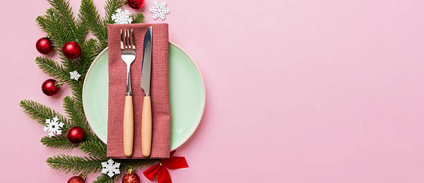 istock Christmas table place setting with christmas decor and plates, kine, fork and spoon. Christmas holiday background. Top view with copy space 2248073728